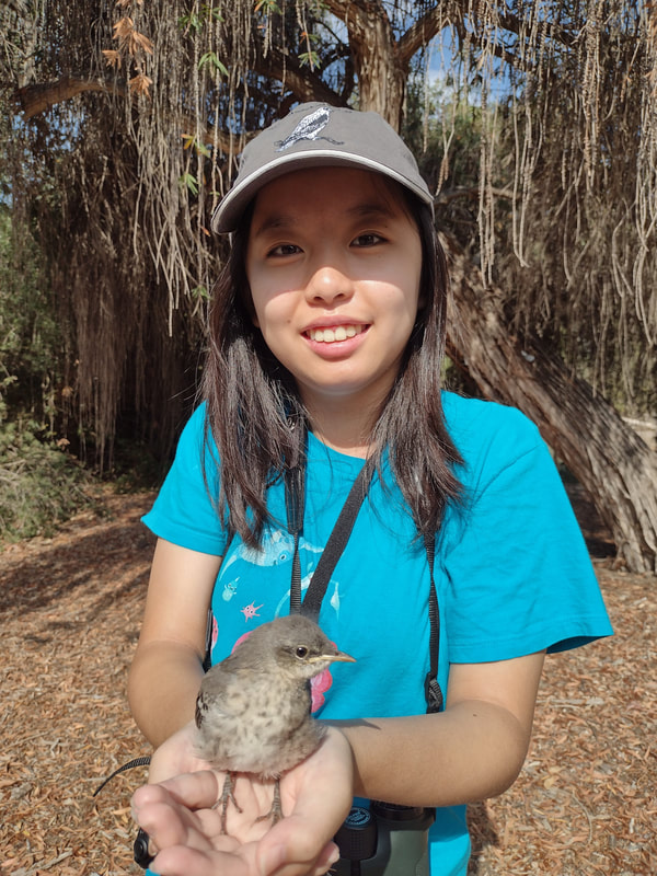 Lara Tseng holding a bird.